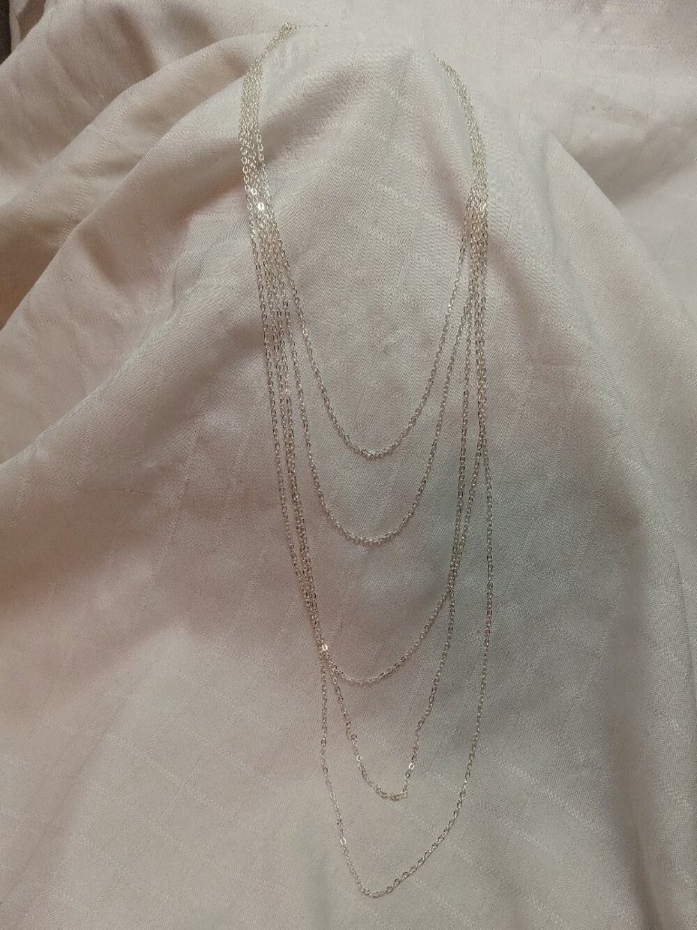 Handmade fashion nacklace with many chain rows in a silver color